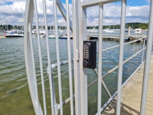 Ornate metal marina gate with digital keypad Superlock bolt on lock with keypad