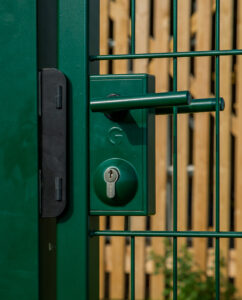 slam plate on green metal gate with lock