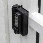 wooden gate with digital keypad lock installed