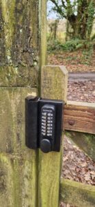 Close up of garden lock both sides on timber gate and fencing for private estates.