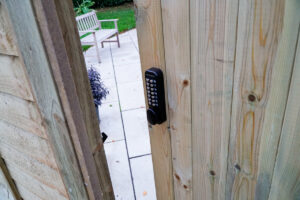 wooden garden gate with digital keypad lock with code installed
