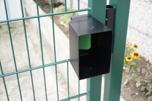 Metal gate shroud on a green metal gate hardware