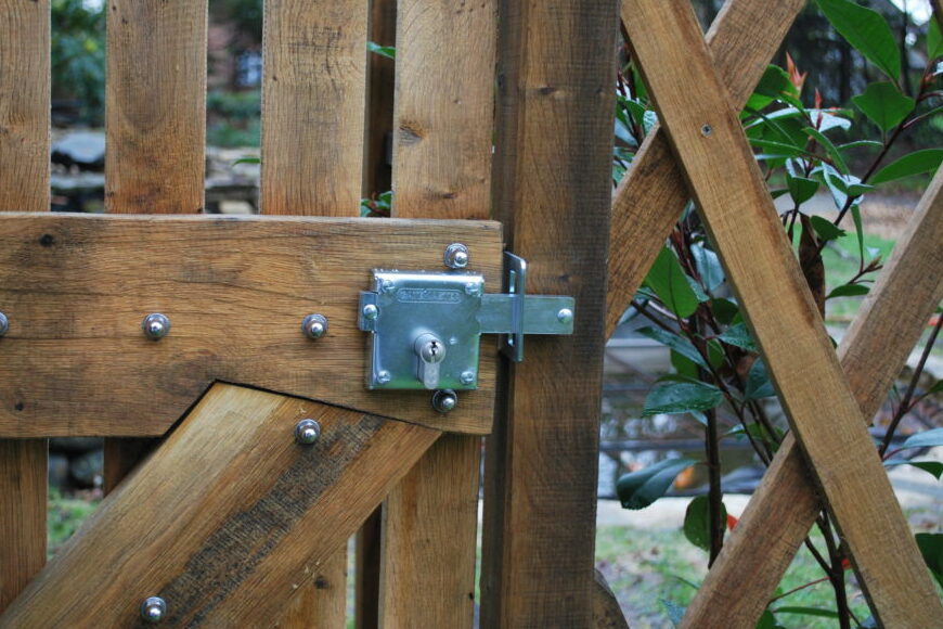 Timber gate with metal locking bolt with wood screw fixings