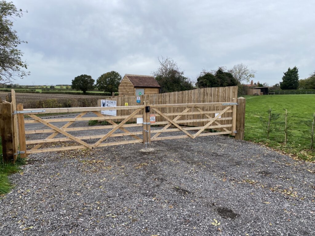 Timber entrance gate to glamping camp site with digital lock installed gate hardware