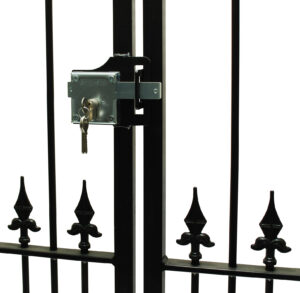 Surface fixed metal gate lock on a gate with scrolls
