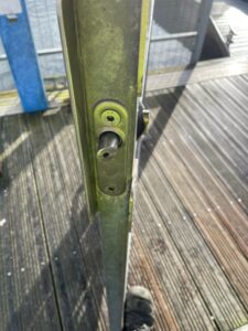 Front of a keylatch installed on a gate at a yacht club