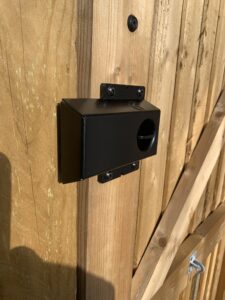 Gate latch and shroud installed on softwood timber gate in garden gate