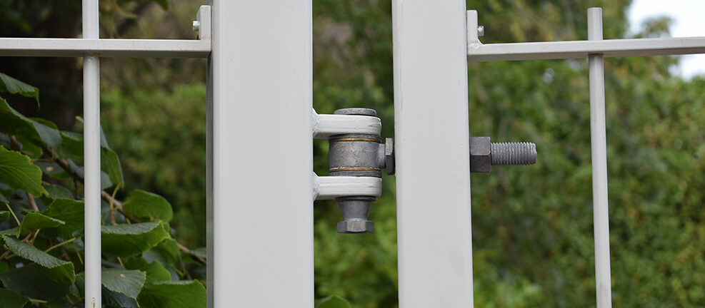 Heavy duty gate hinge in grey metal gate